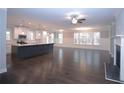 Open-concept kitchen featuring a large island, white cabinets, and stainless steel appliances at 14 Berkten Ct, Hiram, GA 30141