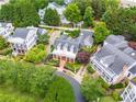 Aerial view showcasing the property nestled among lush greenery in a desirable neighborhood at 3786 Turnberry Ct, Duluth, GA 30096