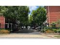 Gated community entrance showcasing lush landscaping, providing privacy and security at 793 Inman Mews Ne Dr, Atlanta, GA 30307
