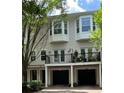 Townhome with bay windows, French doors to a terrace, and garage parking at 793 Inman Mews Ne Dr, Atlanta, GA 30307