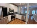 Modern kitchen featuring stainless steel appliances, sleek countertops, and hardwood floors at 793 Inman Mews Ne Dr, Atlanta, GA 30307