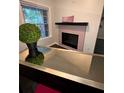 Cozy living room nook with a unique electric fireplace at 220 Renaissance Ne Pkwy # 2220, Atlanta, GA 30308
