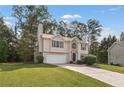 The exterior view showcases the home's manicured lawn and traditional architecture at 5960 Castlegate Dr, Douglasville, GA 30135