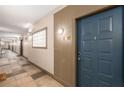 Hallway view leading to an apartment entrance with neutral paint and accent lighting at 400 17Th Nw St # 2308, Atlanta, GA 30363