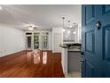 Open concept living room with wood floors and easy access to the updated kitchen at 400 17Th Nw St # 2308, Atlanta, GA 30363