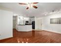 Living room and kitchen combo with hardwood floors and neutral paint at 400 17Th Nw St # 2308, Atlanta, GA 30363