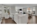 Bright, airy kitchen with an island, stainless steel appliances and large windows allowing for natural light at 545 Hanlon Way, Alpharetta, GA 30009