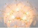 Close-up of a striking modern chandelier with translucent accents adding elegance to the space at 1312 Becket Ne Dr, Brookhaven, GA 30319