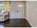 Inviting foyer featuring dark hardwood floors, a stylish front door, and neutral wall colors at 1848 Winthrop Se Dr, Atlanta, GA 30316
