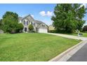 Well-maintained home with a spacious lawn and two-car garage, perfect for suburban living at 3635 Bardfield Ct, Cumming, GA 30041