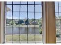 Stunning water view from a large window, framed by elegant trim at 870 Longstone Lndg, Alpharetta, GA 30022