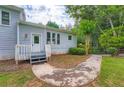 Cozy home entrance with a walkway, featuring a well-maintained yard at 2538 Morgan Lake Ne Dr, Marietta, GA 30066