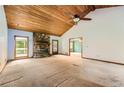 Spacious living room features a stone fireplace and wood planked ceiling at 2538 Morgan Lake Ne Dr, Marietta, GA 30066