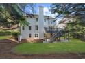 An exterior shot displaying a well-kept backyard with a deck and stairway feature at 745 Glengate Pl, Atlanta, GA 30328