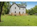 Charming two-story home with a dark roof and newly installed light-colored wood deck at 331 Highway 162, Covington, GA 30016