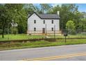 Charming two-story home with a dark roof and newly installed light-colored wood deck at 331 Highway 162, Covington, GA 30016