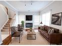 Cozy living room boasts a fireplace, large windows, and comfortable seating, perfect for relaxation at 335 Wilma Sw Ct, Atlanta, GA 30331