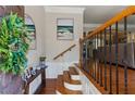 Inviting foyer with hardwood floors and elegant staircase at 3895 Old Atlanta Station Se Dr # 1, Atlanta, GA 30339