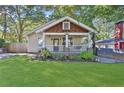 Inviting craftsman home featuring a cozy front porch and well-maintained landscaping at 265 Haas Se Ave, Atlanta, GA 30316