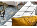 Close up of a bright living room boasting hardwood floors, modern furniture, and a decorative rug at 1090 Shepherds Ne Ln, Atlanta, GA 30324