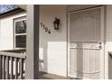 Close-up of the front door and stylish security gate, with brick and house numbers visible at 1104 Oak Knoll Se Ter, Atlanta, GA 30315