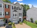Well-kept townhome featuring a combination of brick and siding facade, along with verdant landscaping at 1628 Indian Way, Cumming, GA 30040