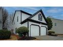 Attractive two-story home showing the siding, trim, garage, and landscaping at 2587 Alvecot Se Cir, Atlanta, GA 30339