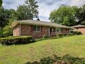 Classic brick exterior with a well-manicured lawn and established shrubbery at 286 Sequoia Ne Dr, Marietta, GA 30060