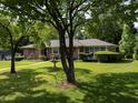 Beautifully landscaped front yard with mature trees offering shade and character at 286 Sequoia Ne Dr, Marietta, GA 30060