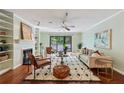 Bright living room with stylish furniture, hardwood floors, and a sliding door to the balcony at 302 Ridley Howard Ct # 302, Decatur, GA 30030