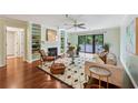 Inviting living room featuring hardwood floors, a fireplace, and a sliding glass door to a balcony at 302 Ridley Howard Ct # 302, Decatur, GA 30030