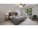 Relaxing bedroom with a cozy bed, window view, and carpeted floor at 1404 N Crossing Ne Dr, Atlanta, GA 30329
