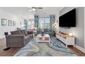 Inviting living room with large windows, modern decor, and stylish rug at 1621 Wellborn Walk, Suwanee, GA 30024