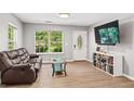 Cozy living room with tiled floors, natural light, and a decorative front door at 5706 Forest Pl, Acworth, GA 30102