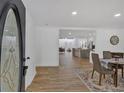 Bright entryway with open floor plan, hardwood floors, and view of the kitchen and living spaces at 144 Cathy Ln, Hiram, GA 30141