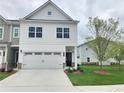 Charming two-story home with a two-car garage and a well-manicured lawn at 1177 Chastain Dr, Sugar Hill, GA 30518