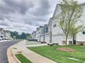 Street view of charming two-story homes, each with a two-car garage at 1177 Chastain Dr, Sugar Hill, GA 30518