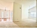 Bright entryway with hardwood floors, coat closet, and view into the living area at 6214 Treeridge Nw Dr, Acworth, GA 30101