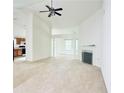 Spacious living room with high ceilings, fireplace, and view into the kitchen at 6214 Treeridge Nw Dr, Acworth, GA 30101