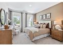 Serene bedroom with neutral tones, plush bedding, and plenty of natural light creates a relaxing retreat at 2903 Sunrise Ridge Rd, Snellville, GA 30078