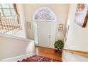 Bright foyer with hardwood flooring and staircase leading to the upper level at 3709 Mcguire Nw St, Kennesaw, GA 30144
