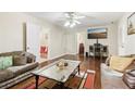 Cozy living room featuring hardwood floors, neutral paint, and comfortable seating at 3709 Mcguire Nw St, Kennesaw, GA 30144