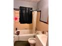 Cozy bathroom with a tub/shower combination and classic tile work at 4513 College St, Forest Park, GA 30297