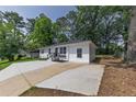 A cozy, renovated one-story home featuring a long driveway, updated paint, and charming curb appeal at 2899 Gresham Se Rd, Atlanta, GA 30316