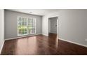 Bright bedroom with large windows offering natural light and hardwood floors at 3545 Turtle Cove Se Ct, Marietta, GA 30067