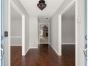 Inviting foyer with hardwood floors, with entrances to dining and living spaces at 3545 Turtle Cove Se Ct, Marietta, GA 30067