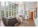 Bright living room features hardwood floors and large windows with plenty of natural light at 650 Garden Wilde Pl, Roswell, GA 30075