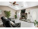 Bright living room with a stone fireplace, vaulted ceilings, skylights and comfortable seating at 3385 Huntington Ct, Douglasville, GA 30134