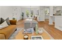 Inviting living room showcasing hardwood floors and open access to the kitchen at 2259 Eastway Rd, Decatur, GA 30033