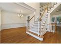 Bright living room featuring hardwood floors, a staircase, and classic trim work at 3450 Merganser Ln, Alpharetta, GA 30022